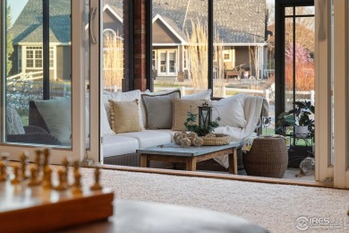 This custom-built home offers stunning lake views throughout the on Pelican Lakes Golf and Country Club in Colorado - for sale on GolfHomes.com, golf home, golf lot