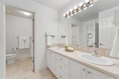 This custom-built home offers stunning lake views throughout the on Pelican Lakes Golf and Country Club in Colorado - for sale on GolfHomes.com, golf home, golf lot