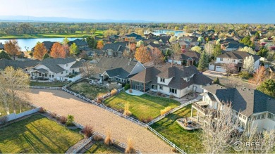This custom-built home offers stunning lake views throughout the on Pelican Lakes Golf and Country Club in Colorado - for sale on GolfHomes.com, golf home, golf lot