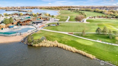 This custom-built home offers stunning lake views throughout the on Pelican Lakes Golf and Country Club in Colorado - for sale on GolfHomes.com, golf home, golf lot