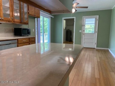 Adjacent to the Meadowlands Golf Course and nestled amongst the on Meadowlands Golf Club in North Carolina - for sale on GolfHomes.com, golf home, golf lot