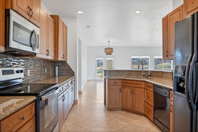 This great home has a sunny view overlooking the adjacent golf on Southgate Golf Course in Utah - for sale on GolfHomes.com, golf home, golf lot