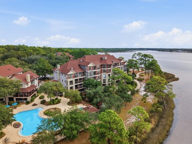 Morning light drifts across Lake Powell, reflecting softly on Sharks Tooth Golf Club in Florida - for sale on GolfHomes.com, golf home, golf lot