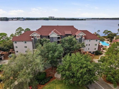 Morning light drifts across Lake Powell, reflecting softly on Sharks Tooth Golf Club in Florida - for sale on GolfHomes.com, golf home, golf lot