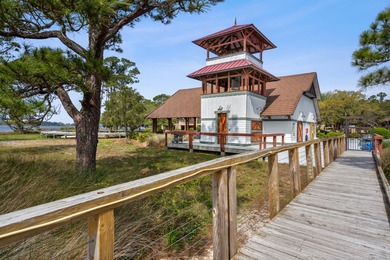 Morning light drifts across Lake Powell, reflecting softly on Sharks Tooth Golf Club in Florida - for sale on GolfHomes.com, golf home, golf lot