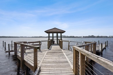 Morning light drifts across Lake Powell, reflecting softly on Sharks Tooth Golf Club in Florida - for sale on GolfHomes.com, golf home, golf lot