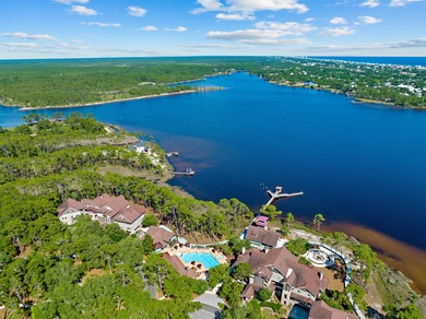 Morning light drifts across Lake Powell, reflecting softly on Sharks Tooth Golf Club in Florida - for sale on GolfHomes.com, golf home, golf lot
