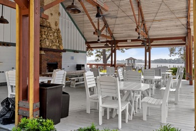 Morning light drifts across Lake Powell, reflecting softly on Sharks Tooth Golf Club in Florida - for sale on GolfHomes.com, golf home, golf lot