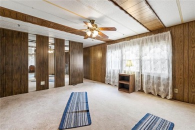 Nice weekend home on 3 LOTS (649, 650, and 651) on popular Buck on Linn Valley Lakes - Deer Trace Golf Course in Kansas - for sale on GolfHomes.com, golf home, golf lot