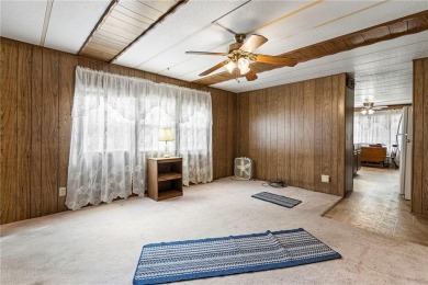 Nice weekend home on 3 LOTS (649, 650, and 651) on popular Buck on Linn Valley Lakes - Deer Trace Golf Course in Kansas - for sale on GolfHomes.com, golf home, golf lot