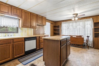 Nice weekend home on 3 LOTS (649, 650, and 651) on popular Buck on Linn Valley Lakes - Deer Trace Golf Course in Kansas - for sale on GolfHomes.com, golf home, golf lot