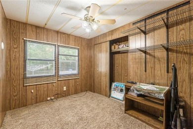 Nice weekend home on 3 LOTS (649, 650, and 651) on popular Buck on Linn Valley Lakes - Deer Trace Golf Course in Kansas - for sale on GolfHomes.com, golf home, golf lot