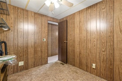 Nice weekend home on 3 LOTS (649, 650, and 651) on popular Buck on Linn Valley Lakes - Deer Trace Golf Course in Kansas - for sale on GolfHomes.com, golf home, golf lot