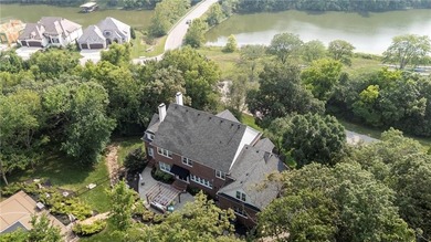 Welcome to this custom-built colonial home in the prestigious on Loch Lloyd Country Club in Missouri - for sale on GolfHomes.com, golf home, golf lot