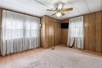 Nice weekend home on 3 LOTS (649, 650, and 651) on popular Buck on Linn Valley Lakes - Deer Trace Golf Course in Kansas - for sale on GolfHomes.com, golf home, golf lot