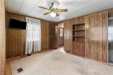 Nice weekend home on 3 LOTS (649, 650, and 651) on popular Buck on Linn Valley Lakes - Deer Trace Golf Course in Kansas - for sale on GolfHomes.com, golf home, golf lot