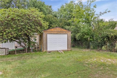 Nice weekend home on 3 LOTS (649, 650, and 651) on popular Buck on Linn Valley Lakes - Deer Trace Golf Course in Kansas - for sale on GolfHomes.com, golf home, golf lot