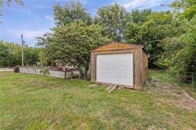 Nice weekend home on 3 LOTS (649, 650, and 651) on popular Buck on Linn Valley Lakes - Deer Trace Golf Course in Kansas - for sale on GolfHomes.com, golf home, golf lot