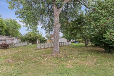 Nice weekend home on 3 LOTS (649, 650, and 651) on popular Buck on Linn Valley Lakes - Deer Trace Golf Course in Kansas - for sale on GolfHomes.com, golf home, golf lot