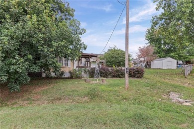 Nice weekend home on 3 LOTS (649, 650, and 651) on popular Buck on Linn Valley Lakes - Deer Trace Golf Course in Kansas - for sale on GolfHomes.com, golf home, golf lot