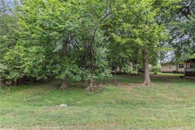 Nice weekend home on 3 LOTS (649, 650, and 651) on popular Buck on Linn Valley Lakes - Deer Trace Golf Course in Kansas - for sale on GolfHomes.com, golf home, golf lot