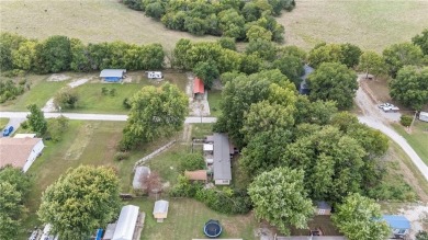 Nice weekend home on 3 LOTS (649, 650, and 651) on popular Buck on Linn Valley Lakes - Deer Trace Golf Course in Kansas - for sale on GolfHomes.com, golf home, golf lot
