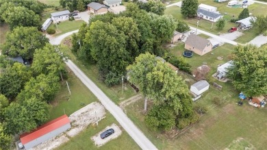 Nice weekend home on 3 LOTS (649, 650, and 651) on popular Buck on Linn Valley Lakes - Deer Trace Golf Course in Kansas - for sale on GolfHomes.com, golf home, golf lot