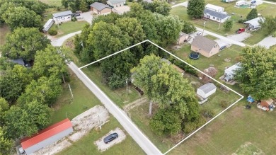 Nice weekend home on 3 LOTS (649, 650, and 651) on popular Buck on Linn Valley Lakes - Deer Trace Golf Course in Kansas - for sale on GolfHomes.com, golf home, golf lot