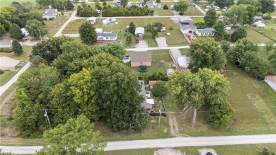 Nice weekend home on 3 LOTS (649, 650, and 651) on popular Buck on Linn Valley Lakes - Deer Trace Golf Course in Kansas - for sale on GolfHomes.com, golf home, golf lot