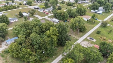 Nice weekend home on 3 LOTS (649, 650, and 651) on popular Buck on Linn Valley Lakes - Deer Trace Golf Course in Kansas - for sale on GolfHomes.com, golf home, golf lot