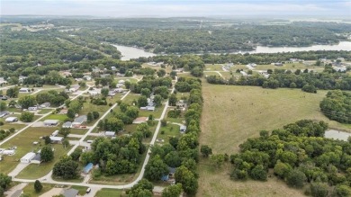 Nice weekend home on 3 LOTS (649, 650, and 651) on popular Buck on Linn Valley Lakes - Deer Trace Golf Course in Kansas - for sale on GolfHomes.com, golf home, golf lot