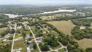 Nice weekend home on 3 LOTS (649, 650, and 651) on popular Buck on Linn Valley Lakes - Deer Trace Golf Course in Kansas - for sale on GolfHomes.com, golf home, golf lot
