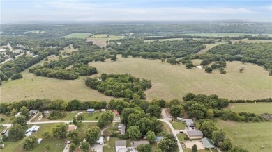 Nice weekend home on 3 LOTS (649, 650, and 651) on popular Buck on Linn Valley Lakes - Deer Trace Golf Course in Kansas - for sale on GolfHomes.com, golf home, golf lot