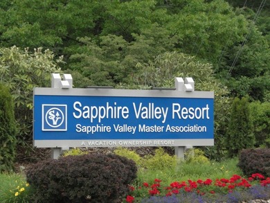 Nestled in the scenic beauty of Sapphire Valley, this delightful on Sapphire National Golf Club in North Carolina - for sale on GolfHomes.com, golf home, golf lot