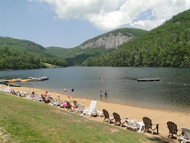 Nestled in the scenic beauty of Sapphire Valley, this delightful on Sapphire National Golf Club in North Carolina - for sale on GolfHomes.com, golf home, golf lot