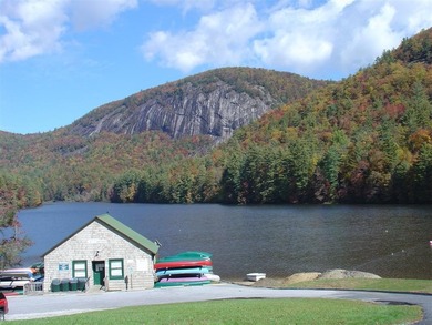 Nestled in the scenic beauty of Sapphire Valley, this delightful on Sapphire National Golf Club in North Carolina - for sale on GolfHomes.com, golf home, golf lot
