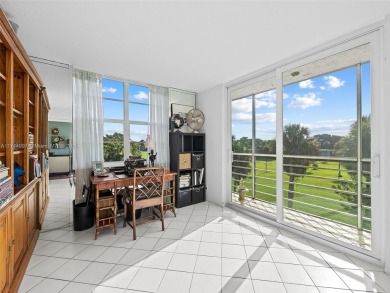 Step into South Florida living with this corner-unit stunning on Oaks Country Club in Florida - for sale on GolfHomes.com, golf home, golf lot