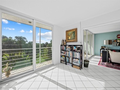 Step into South Florida living with this corner-unit stunning on Oaks Country Club in Florida - for sale on GolfHomes.com, golf home, golf lot