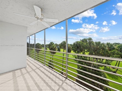 Step into South Florida living with this corner-unit stunning on Oaks Country Club in Florida - for sale on GolfHomes.com, golf home, golf lot