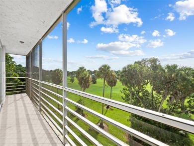 Step into South Florida living with this corner-unit stunning on Oaks Country Club in Florida - for sale on GolfHomes.com, golf home, golf lot