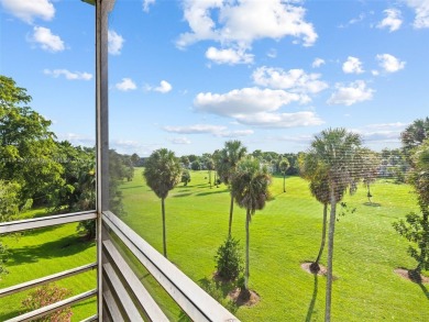 Step into South Florida living with this corner-unit stunning on Oaks Country Club in Florida - for sale on GolfHomes.com, golf home, golf lot