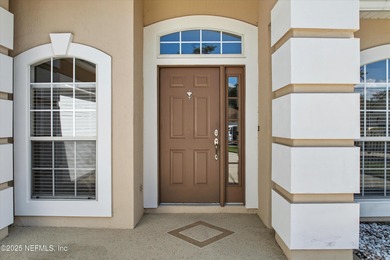 Nestled within the gated golf community of Cimarrone Golf & on Cimarrone Golf and Country Club in Florida - for sale on GolfHomes.com, golf home, golf lot