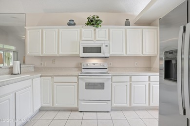 Nestled within the gated golf community of Cimarrone Golf & on Cimarrone Golf and Country Club in Florida - for sale on GolfHomes.com, golf home, golf lot