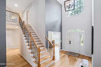 Nestled on a quiet tree-lined street, this custom-built home on Members Club At St. James Plantation in North Carolina - for sale on GolfHomes.com, golf home, golf lot