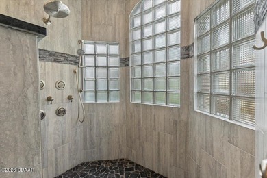 The epitome of privacy and luxury, the gated Lionspaw Grand on LPGA International Golf Course in Florida - for sale on GolfHomes.com, golf home, golf lot