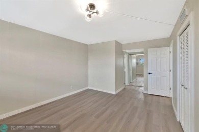 Completely and magnificently updated PENTHOUSE unit with on Palm-Aire Country Club and Resort - Palms in Florida - for sale on GolfHomes.com, golf home, golf lot