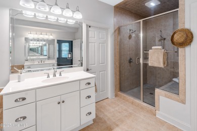 Nestled on a quiet tree-lined street, this custom-built home on Members Club At St. James Plantation in North Carolina - for sale on GolfHomes.com, golf home, golf lot