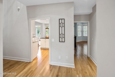 Nestled on a quiet tree-lined street, this custom-built home on Members Club At St. James Plantation in North Carolina - for sale on GolfHomes.com, golf home, golf lot