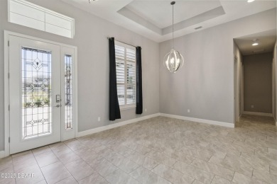 Live the resort lifestyle at 336 Stirling Bridge Drive, nestled on Plantation Bay Golf and Country Club in Florida - for sale on GolfHomes.com, golf home, golf lot