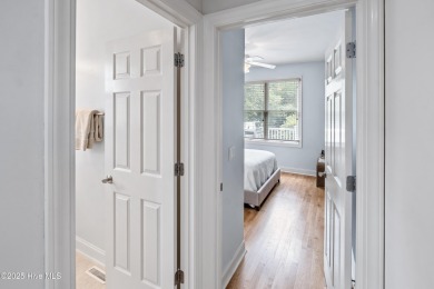 Nestled on a quiet tree-lined street, this custom-built home on Members Club At St. James Plantation in North Carolina - for sale on GolfHomes.com, golf home, golf lot